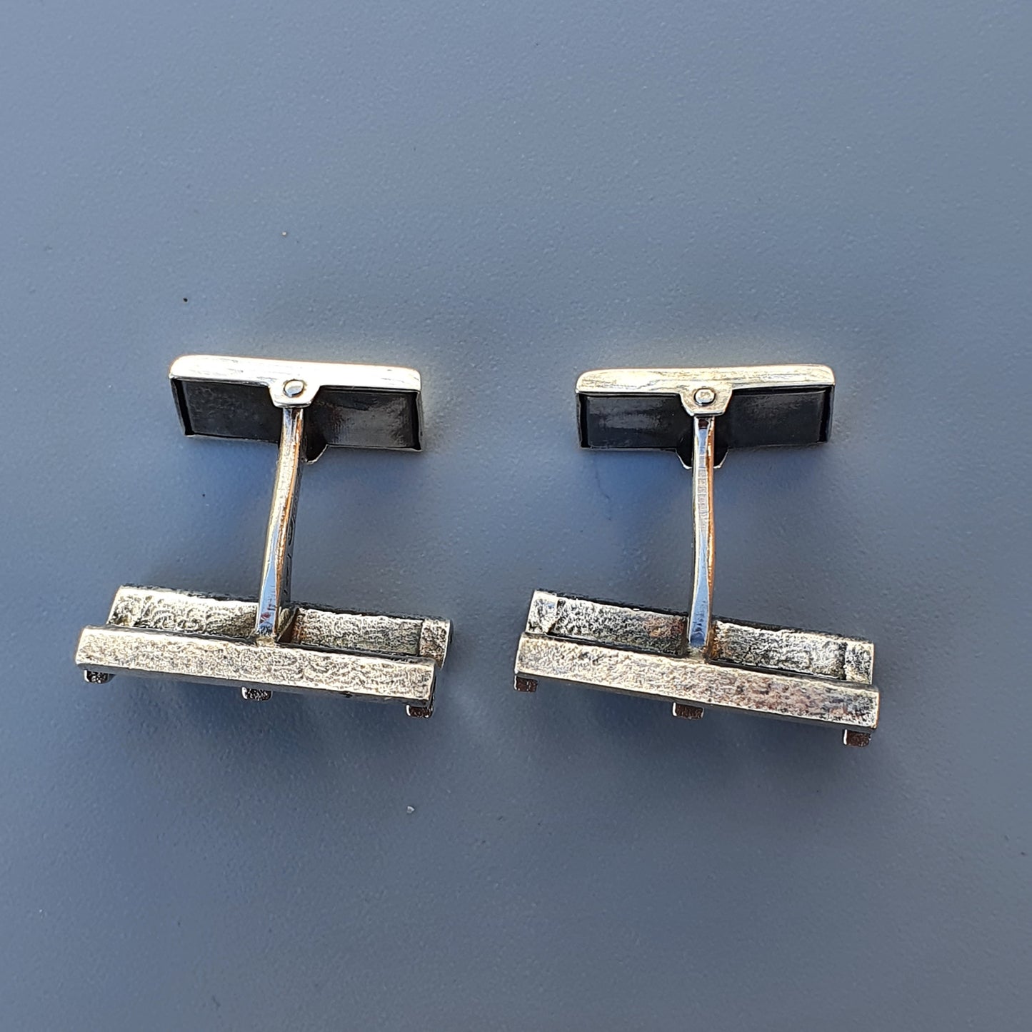 Pair of vintage silver and black rectangular cufflinks.