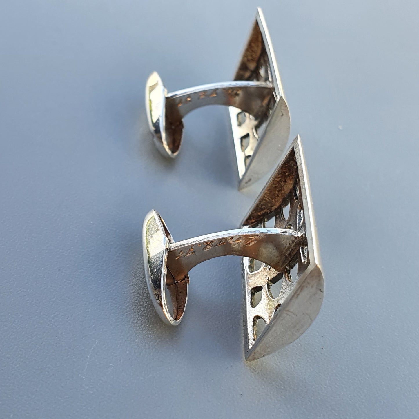 Pair of silver cufflinks with an angular, modernist design.