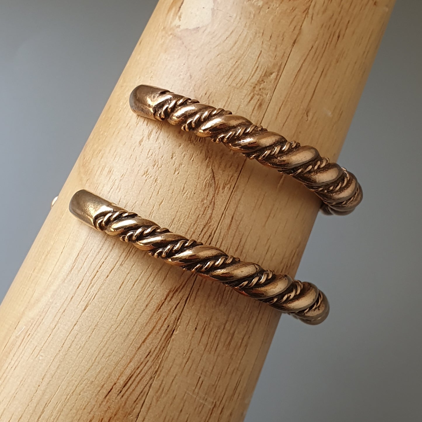 Twisted metal ring with a spiral rope-like design.