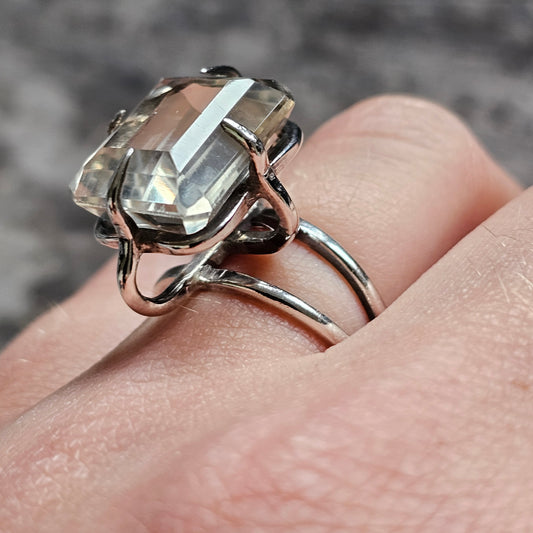 Vintage-style silver ring with a prominent smoky quartz gemstone.