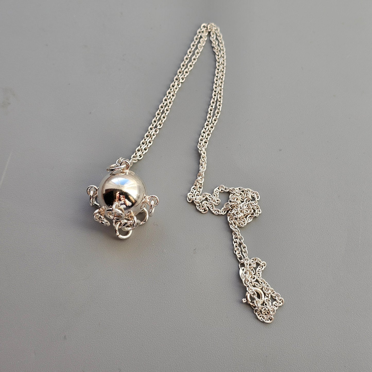 Finnish Silver Komsiopallo / Cradle Ball Necklace Pendant by Taiga Koru