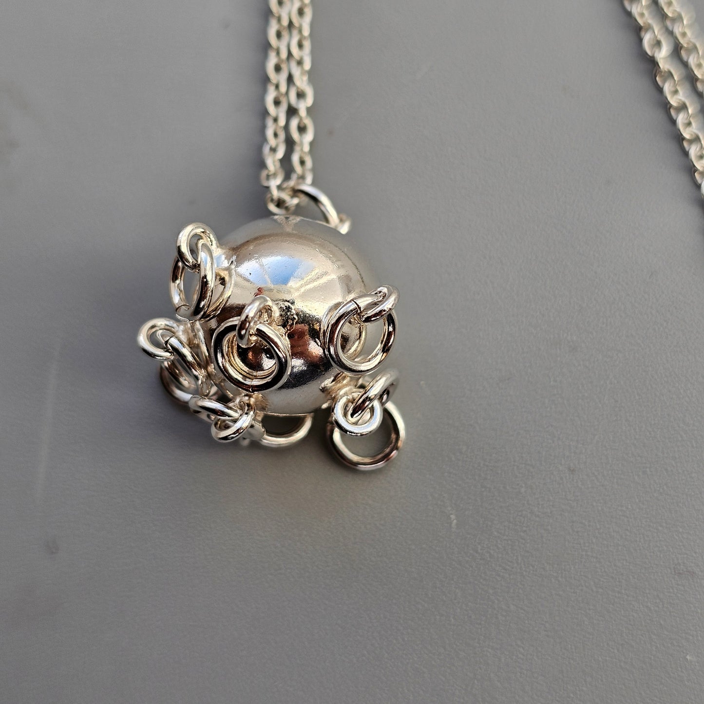 Finnish Silver Komsiopallo / Cradle Ball Necklace Pendant by Taiga Koru