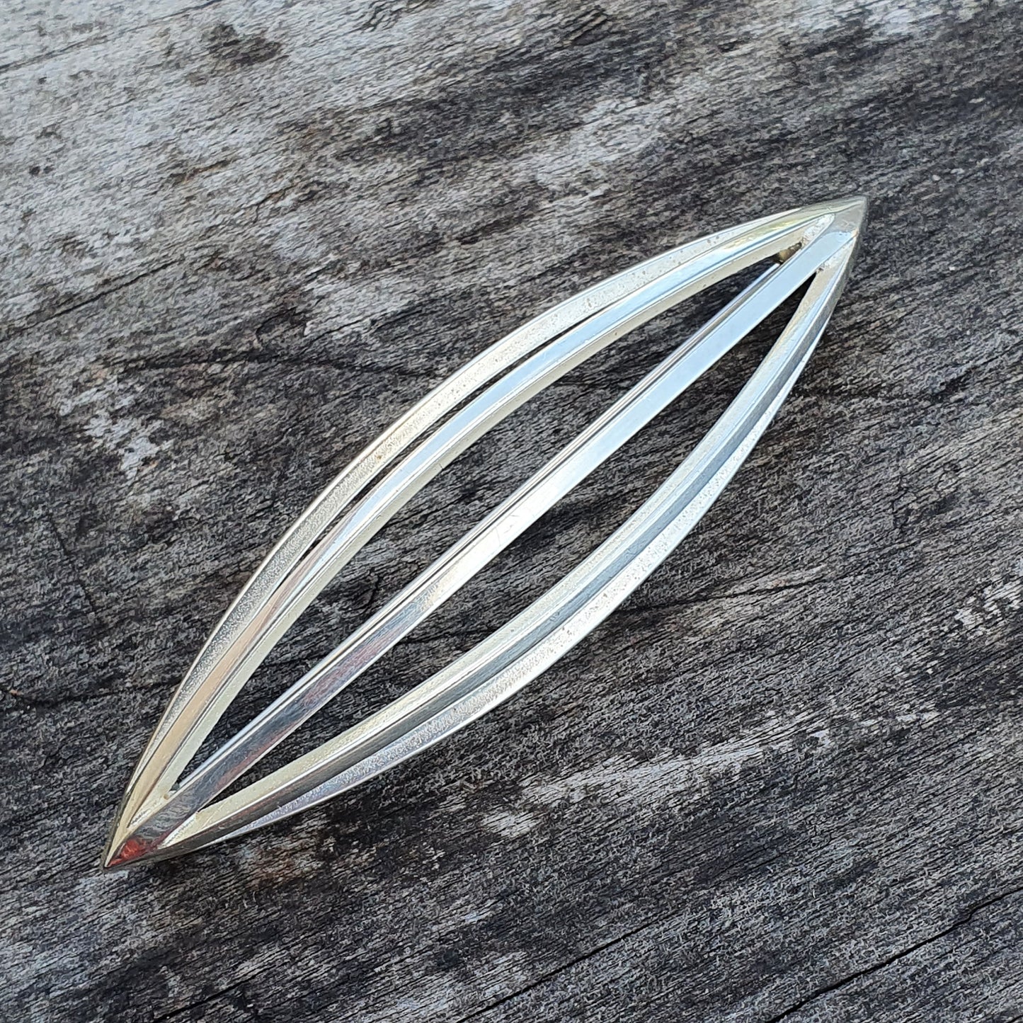 Elongated pointed seed pod silver brooch by Kaunis Koru in Finnish silver design