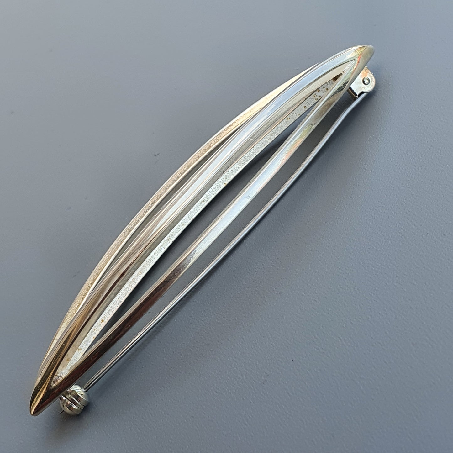 Sleek Finnish Silver Brooch by Kaunis Koru with curved design and ridged texture