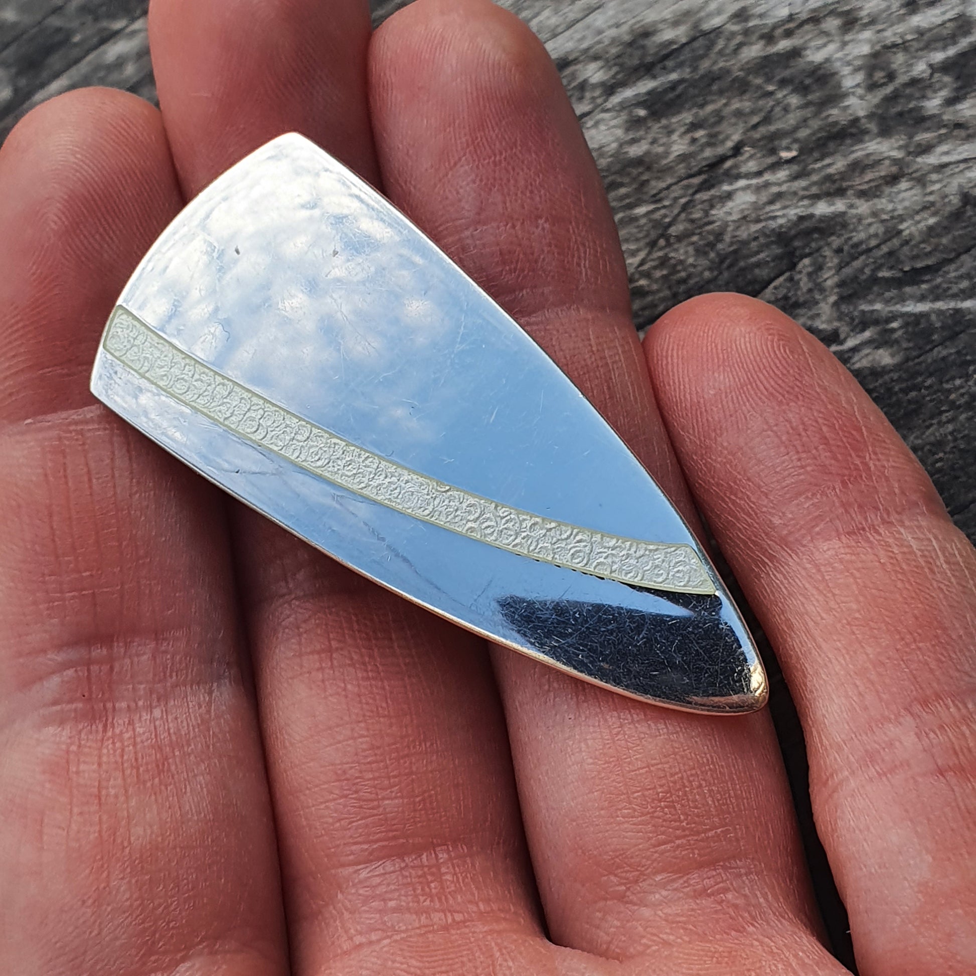 Triangular gemstone with sky-like pattern on Modern Finnish White Enamel Brooch by Platinoro