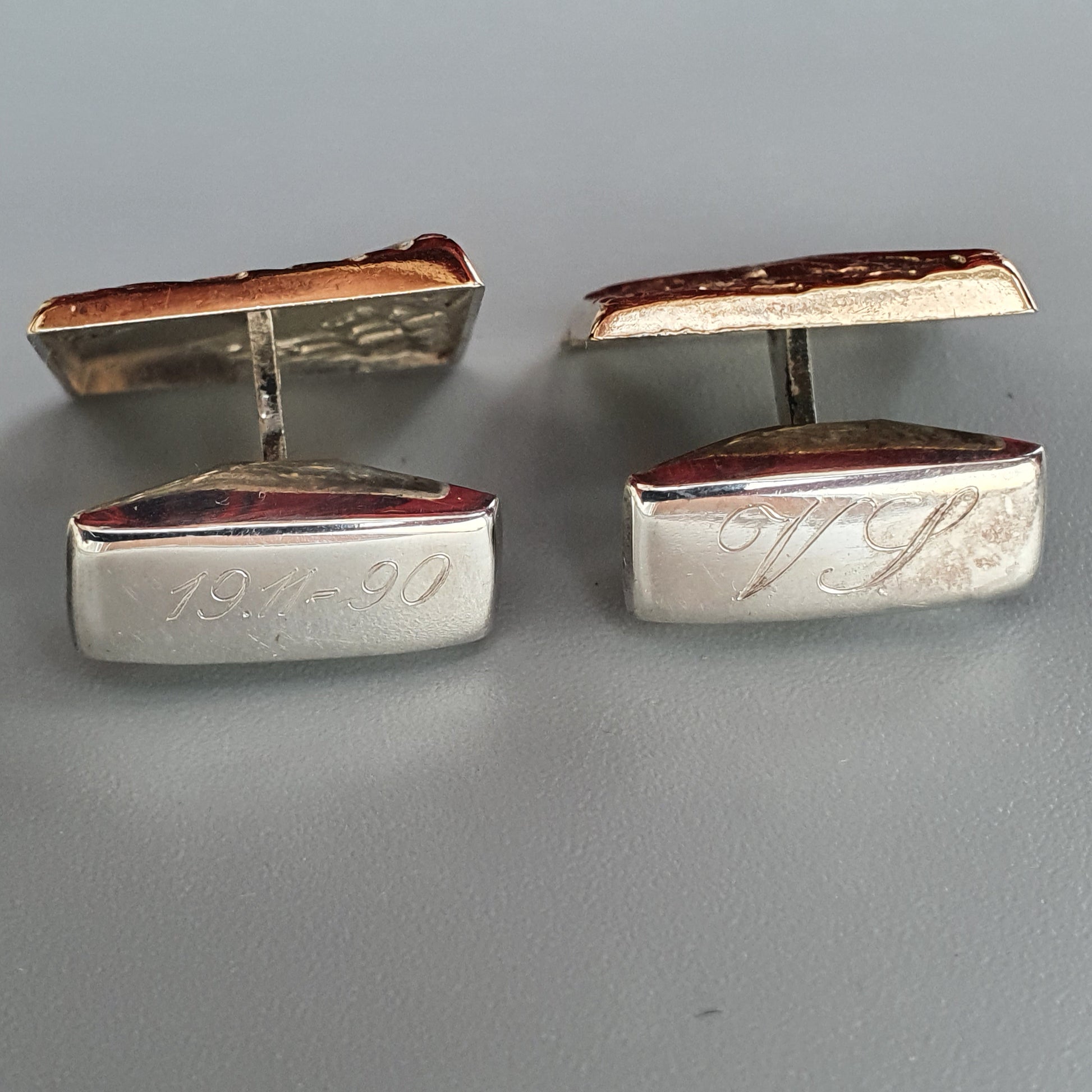 Pair of vintage silver and copper cufflinks with engraved initials.