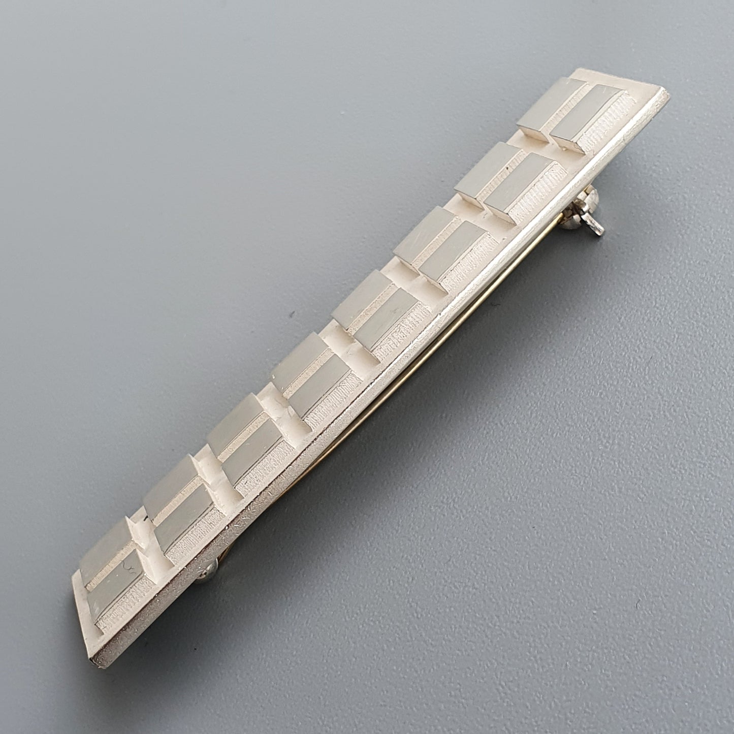 Ivory plastic hair clip with ladder design paired with Finnish Minimalist Rectangular Silver Brooch