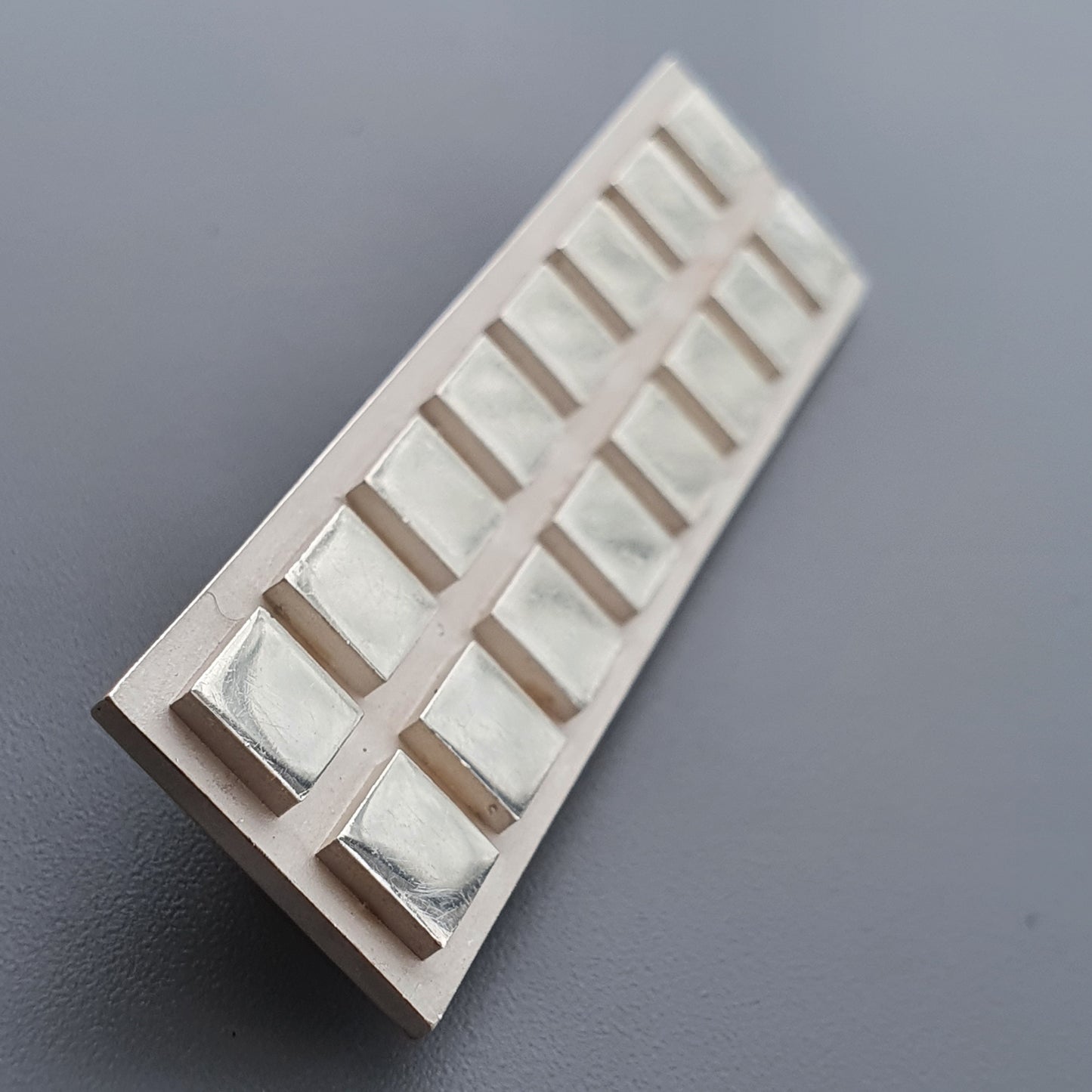 Plastic ice cube tray with rectangular compartments for Finnish Minimalist Rectangular Silver Brooch